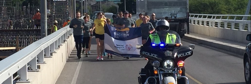 Chief MacCulloch running with officers law enforcement torch run 